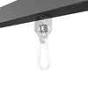 A close-up of a black metal beam with a gray roller bearing and a carabiner attached. Produktbild-Vorschau