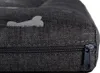 A close-up view of a dark gray dog bed with a bone pattern and a zipper. Náhľad obrázku produktu