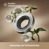 A close-up of a hair dryer attachment with white flowers and green leaves against a soft, gradient background. Náhled obrázku produktu