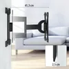 A black TV wall mount is shown attached to a white wall, with a sofa in the background. Dimensions are indicated with text and lines. Produktbild-Vorschau