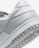 Close-up view of the heel and sole of a white and gray Nike sneaker. Náhled obrázku produktu