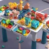 A children's building block play table with various animal figures and blocks. Anteprima dell’immagine prodotto
