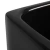 Close-up of the glossy black rim of a rectangular ceramic planter. Náhled obrázku produktu