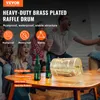 People watching a game and a raffle drum on a table. Náhled obrázku produktu
