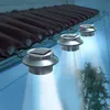 Solar-powered lights attached to a roof gutter, illuminating the area below. Voir les images du produit