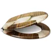 A toilet seat with a wood grain pattern and heart shapes. Produktbild-Vorschau