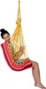 A woman is sitting in a colorful hammock chair. Produktbild-Vorschau