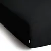 A close-up, angled view of a black fitted sheet. Produktbild-Vorschau