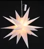A white star-shaped lantern with internal lights against a black background. Produktbild-Vorschau