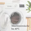 A washing machine with its door open, showing a brown blanket inside. Text overlay provides washing instructions. Produktbild-Vorschau