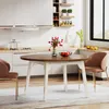 A round dining table with chairs in a modern kitchen setting. Náhľad obrázku produktu