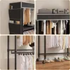 A collage of images showcasing a black fabric wardrobe with clothes hanging inside and on shelves. The bottom right image also shows shoes on the floor. Produktbild-Vorschau
