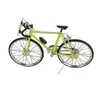 A miniature green bicycle ornament is shown against a white background. Produktbild-Vorschau
