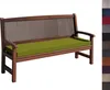 A wooden bench with a green cushion. Produktbild-Vorschau