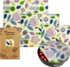 A collage of beeswax food wraps with a floral pattern, including packaging and a wrap covering a bowl of tomatoes. Náhľad obrázku produktu