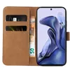 A brown flip-style phone case with slots for cards and cash, open to reveal a smartphone with a colorful abstract wallpaper. Produktbild-Vorschau