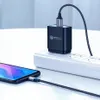 A smartphone is being charged by a wall adapter plugged into a power strip. Produktbild-Vorschau