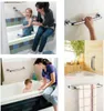 Collage of images showing grab bars in bathroom settings, including a mother and child in a bathtub, a hand gripping a grab bar, and a grab bar with a towel. Náhled obrázku produktu