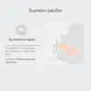 Diagram illustrating the symmetrical nipple of a pacifier and its placement in a baby's mouth. Produktbild-Vorschau