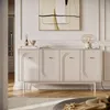 A modern living room with a beige sideboard, a lamp, and artwork. Produktbild-Vorschau