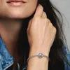 A woman's hand wearing a bracelet with a charm. Anteprima dell’immagine prodotto