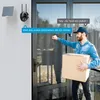 A delivery person is at the door with a package, interacting with a smart doorbell camera. Náhled obrázku produktu