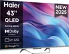 A Haier 43-inch QLED TV with a colorful abstract background and marketing text overlays. Voir les images du produit