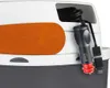 A close-up view of the side of a cooler box, showing a car charger and a USB cable plugged into a compartment. Produktbild-Vorschau