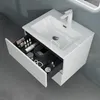 A top-down view of a white bathroom vanity with an open drawer filled with toiletries. Produktbild-Vorschau