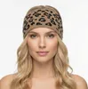 A woman wearing a leopard print headband. Produktbild-Vorschau