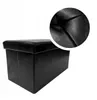 A black storage ottoman is shown against a white background, with a close-up inset of the textured material. Podgląd zdjęcia produktu