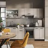 A modern kitchen with a dining area, featuring a kitchen unit, stove, sink, and dining table with chairs. Anteprima dell’immagine prodotto