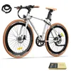 A white electric bicycle with brown accents is displayed on a white background. A black bicycle lock is shown in the upper left corner, and a gift box containing accessories is in the lower right corner. Produktbild-Vorschau