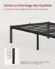Close-up of a black metal bed frame, showing how to attach a headboard. Produktbild-Vorschau