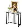 A console table with a marble top and black metal frame, decorated with a painting of flowers, books, and a sculpture. Podgląd zdjęcia produktu
