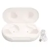 A white charging case for wireless earbuds, open, with a white USB charging cable next to it. Náhled obrázku produktu