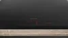 A close-up view of a black induction hob with red digital displays. Produktbild-Vorschau