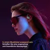 A woman wearing sunglasses and wireless earbuds, with colorful lighting. Produktbild-Vorschau