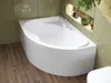 A white corner bathtub with a curved front panel, set against light green tiled walls and a wooden floor. Produktbild-Vorschau