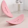 Two pink balance boards are shown in a room, one leaning against a wall and the other on the floor. Podgląd zdjęcia produktu