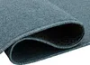 A close-up view of a rolled-up blue carpet, showing the texture and the underside with a diamond pattern. Produktbild-Vorschau