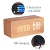 A digital alarm clock made of wood with a wireless charging pad on top, displaying time, temperature, and humidity. Insets show battery compartment and USB charging port. Produktbild-Vorschau