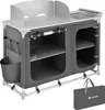 A camping kitchen unit with storage and a sink, shown with its carrying bag. Voir les images du produit