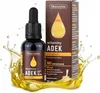 A bottle of Skoczylas ADEK vitamins with a box and liquid splashing around it. Voir les images du produit