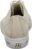 A close-up rear view of a cream-colored sneaker with gold accents. Produktbild-Vorschau