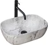 A countertop sink with a modern black faucet. Podgląd zdjęcia produktu