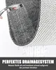 A close-up of a gray shower mat with water draining through it, demonstrating its drainage system. Produktbild-Vorschau
