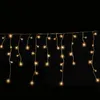A string of icicle-shaped lights against a black background. Produktbild-Vorschau