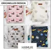 A collage of four different organizer bags with various patterns, displayed on a white, fluffy surface. Produktbild-Vorschau