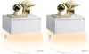 Two white wall-mounted nightstands with integrated LED lighting, each adorned with a decorative sphere and a vase of flowers. Náhled obrázku produktu